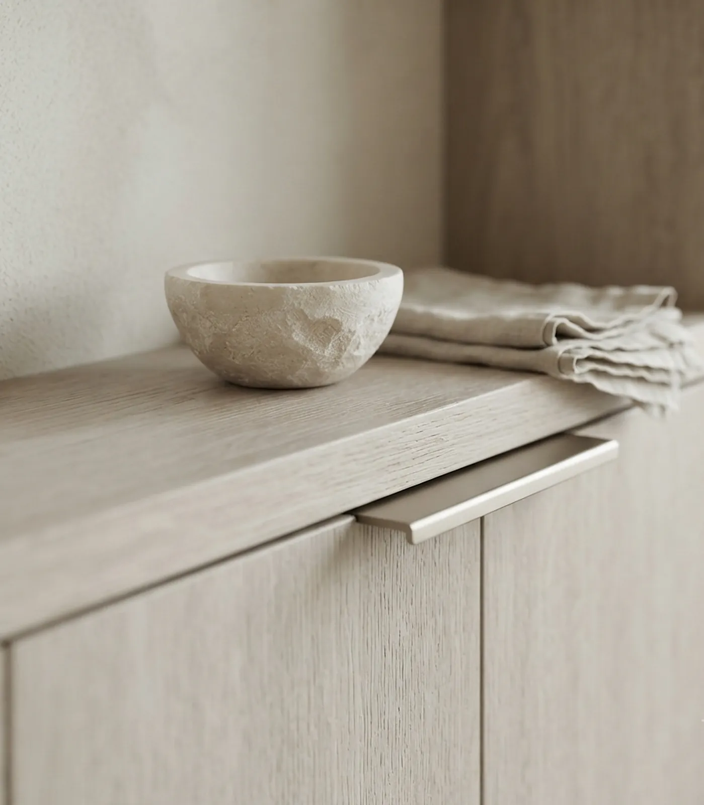 Oak shelf with a stone bowl and linen cloth