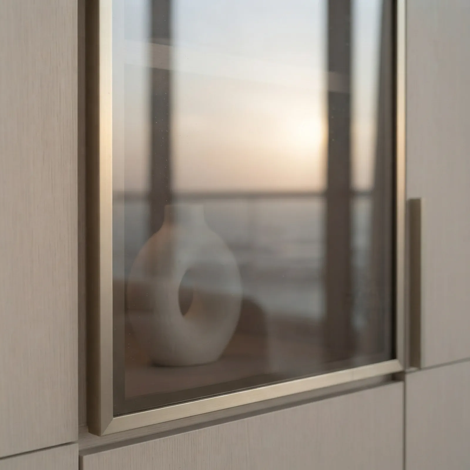Smoked glass cabinet door with champagne frame