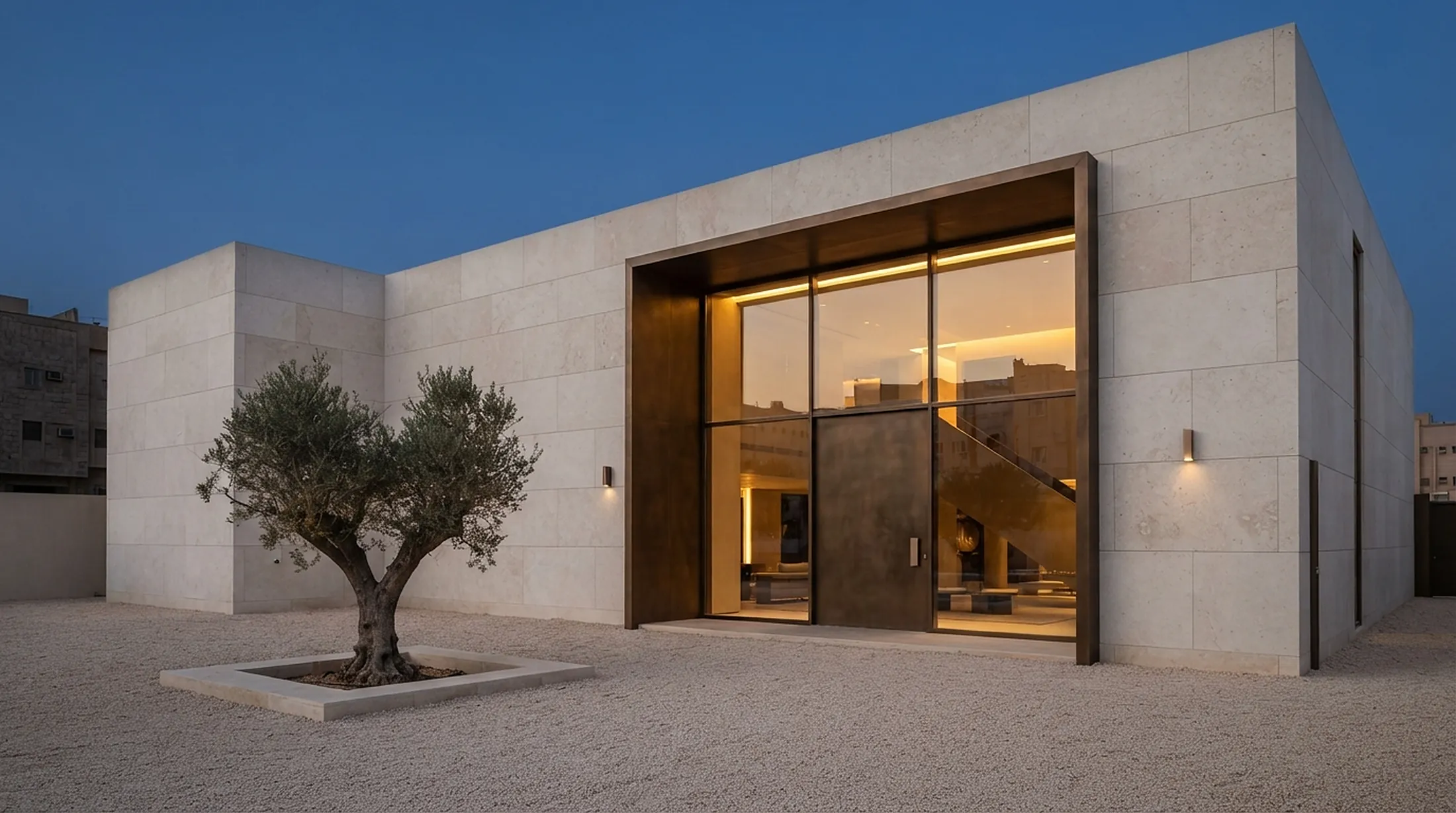 Ivorra showroom in pale limestone at dusk